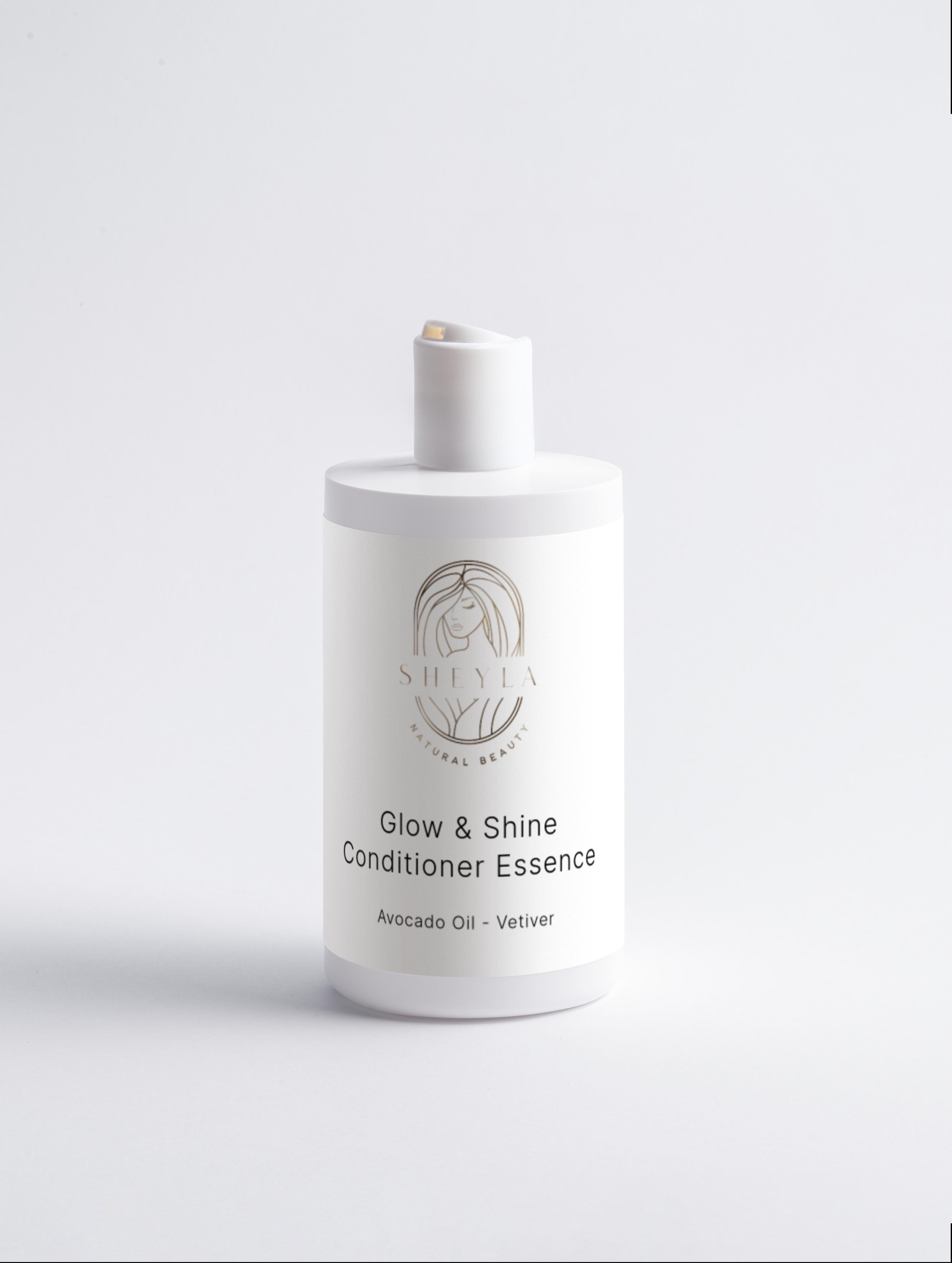 Glow & Shine Conditioner Essence von Sheyla – weiße Flasche mit Klickdeckel, Beschriftung ‚Avocado Oil & Vetiver‘, auf hellem Hintergrund