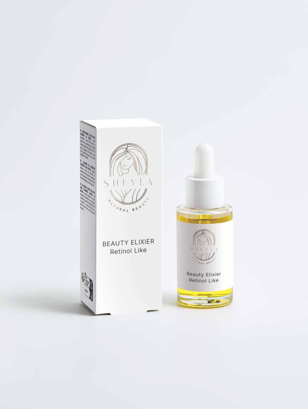 Beauty Elixier Retinol-Like von Sheyla – kleine Glasflasche mit Pipette neben weißer Produktverpackung, auf hellem Hintergrund